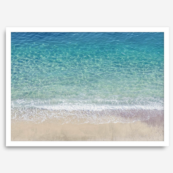 This fine art aerial beach print showcases the mesmerizing colors of the ocean in vivid detail. From the deep blue depths to the vibrant greenish turquoise blue, transitioning to the golden sandy beach and the crashing white surf.