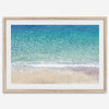 This fine art aerial beach print showcases the mesmerizing colors of the ocean in vivid detail. From the deep blue depths to the vibrant greenish turquoise blue, transitioning to the golden sandy beach and the crashing white surf.