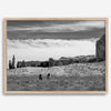 This Utah desert fine art photography print features two horse riders riding toward the horizon of the Utah desert with the unique towering rocks of Monument Valley as the backdrop. The dramatic cloudy sky adds intensity and beauty to the scene.