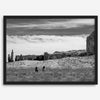 This Utah desert fine art photography print features two horse riders riding toward the horizon of the Utah desert with the unique towering rocks of Monument Valley as the backdrop. The dramatic cloudy sky adds intensity and beauty to the scene.