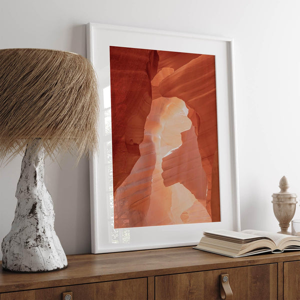 A fine art Arizona Desert print showcasing Antelope Canyon in Arizona. The three layers of rocks in varying colors and creamy textures create a stunning minimalist desert landscape, with vibrant reds and oranges adding warmth to any space.