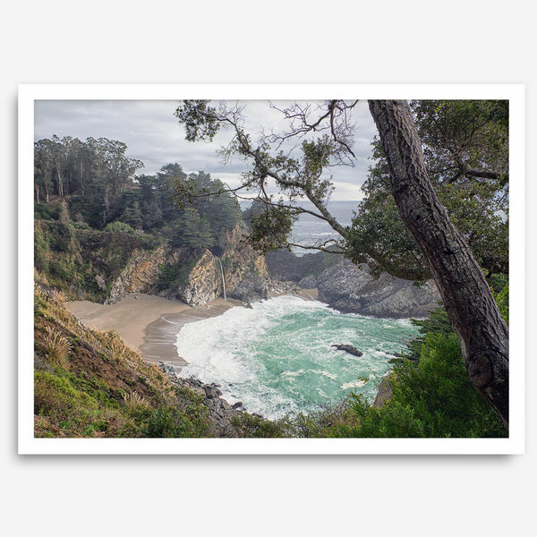 This fine art coastal ocean print features a breathtaking view of Mcway Falls in Big Sur, California, falling to the beach and into the ocean. This fine art photography print captures the beauty and wilderness of nature.