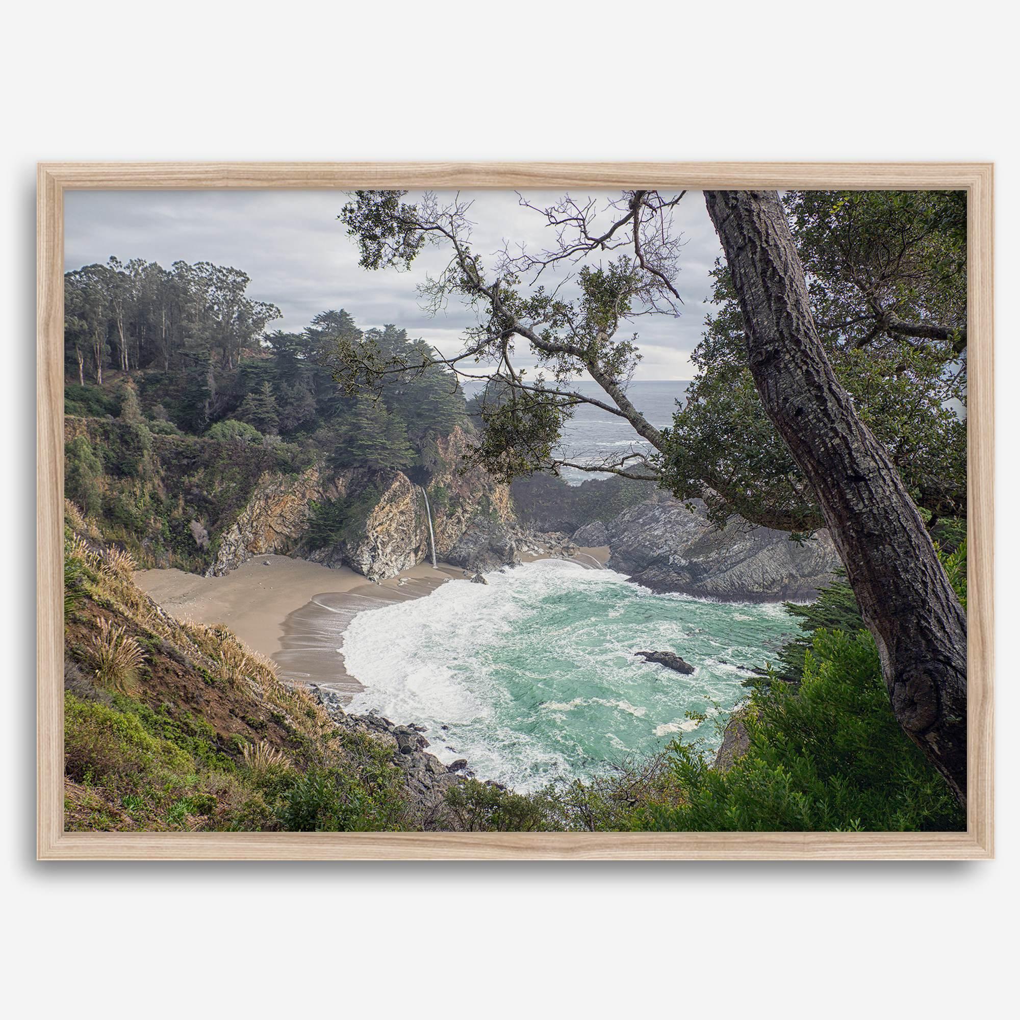 This fine art coastal ocean print features a breathtaking view of Mcway Falls in Big Sur, California, falling to the beach and into the ocean. This fine art photography print captures the beauty and wilderness of nature.