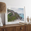 A fine art ocean print of one of the most iconic spots in the famous Route 1 in California - Bixby Bridge near Big Sur. Shot in a unique wide angle that captures the bridge, cliffs, the ocean, and the stunning beach below.