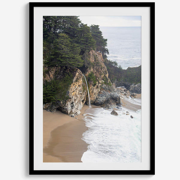 This captivating California coastal beach print captures the awe-inspiring scene of McWay Falls in Big Sur, as its creamy waterfall cascades onto a pristine beach and merges with the rhythmic dance of the ocean waves.