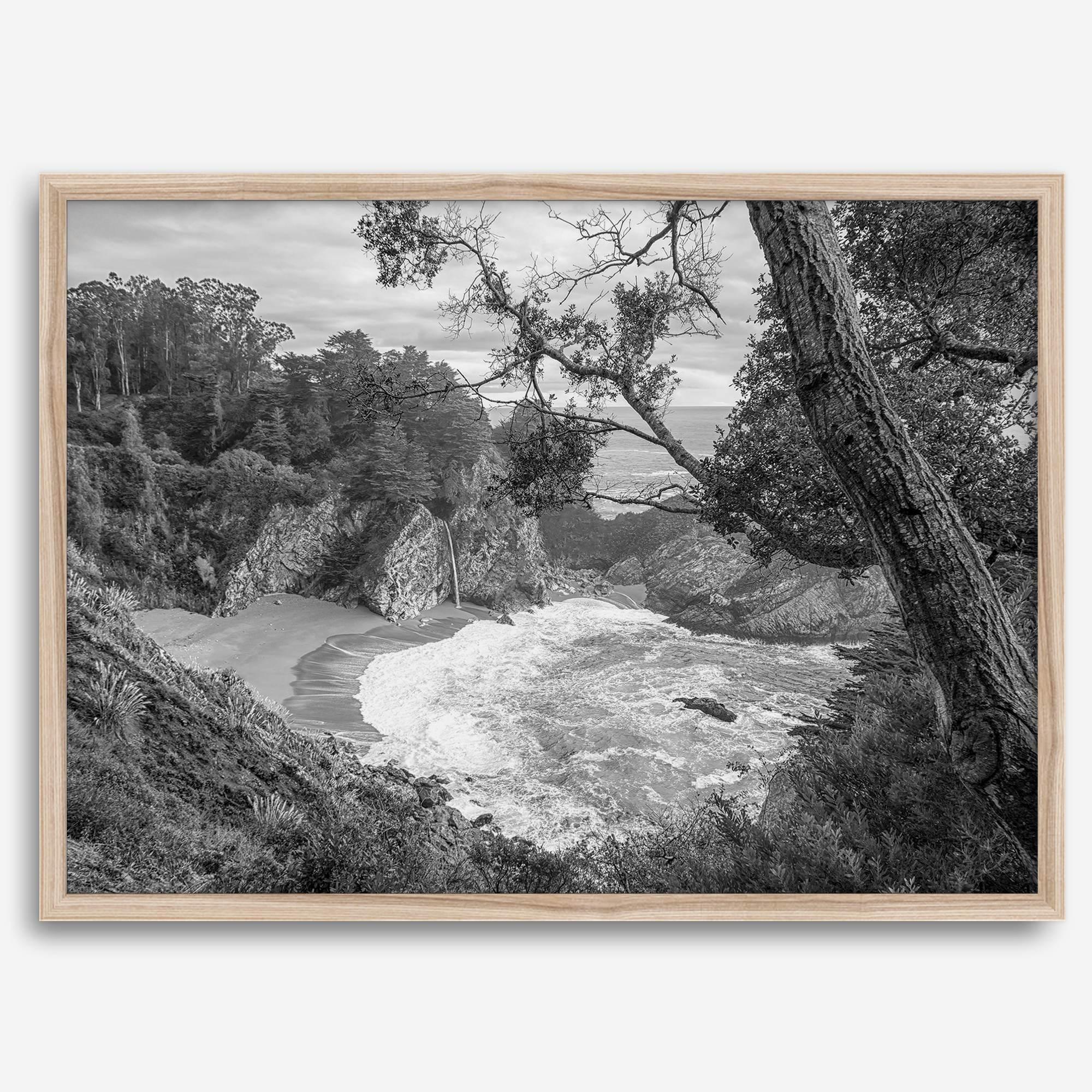 Black and white photo of McWay Falls flowing into the Pacific Ocean at Big Sur, California – fine art coastal print