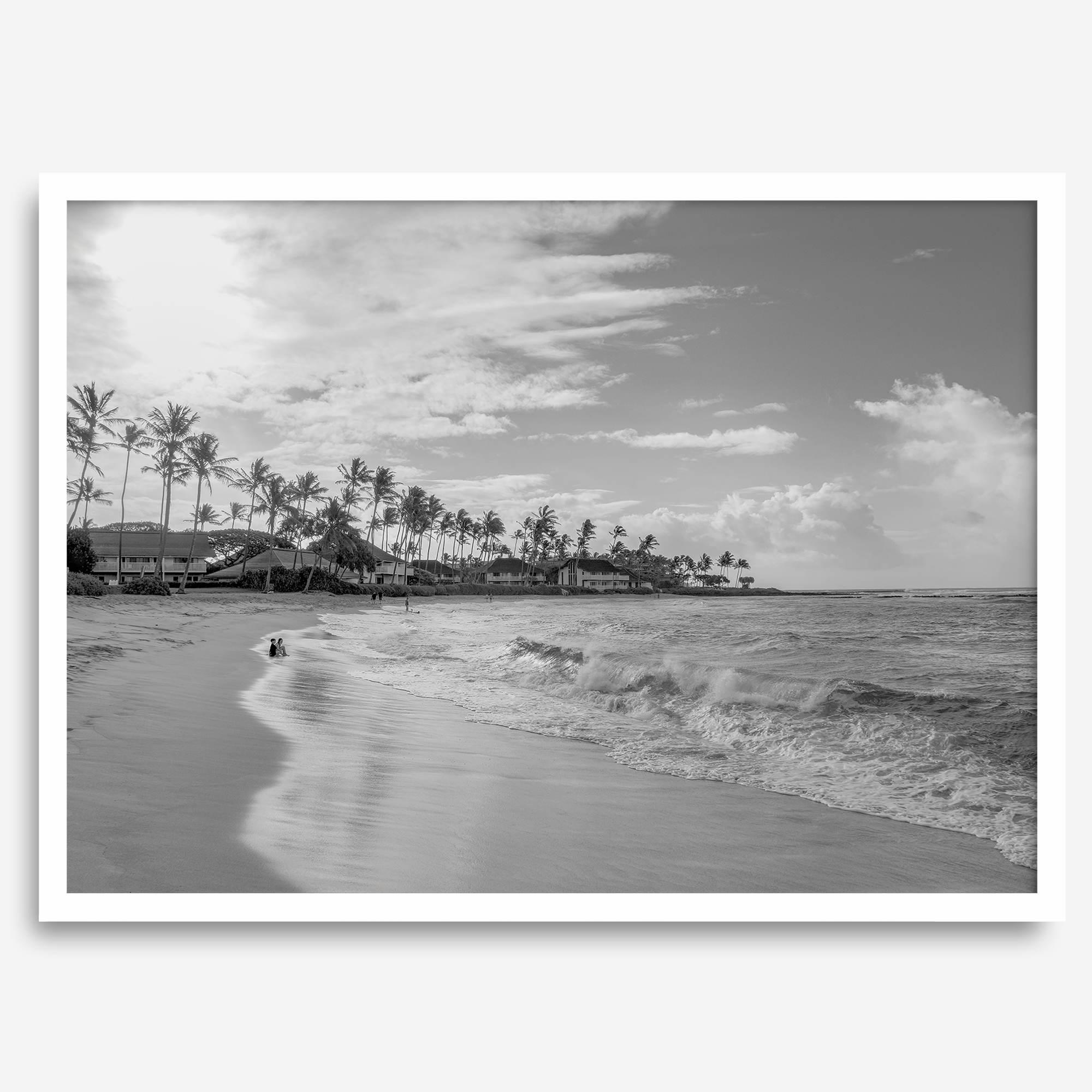 Black and white tropical wall art featuring a serene sunrise on a beach in Kauai, Hawaii with palm trees
