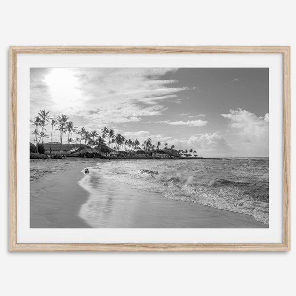 Black and white tropical wall art featuring a serene sunrise on a beach in Kauai, Hawaii with palm trees