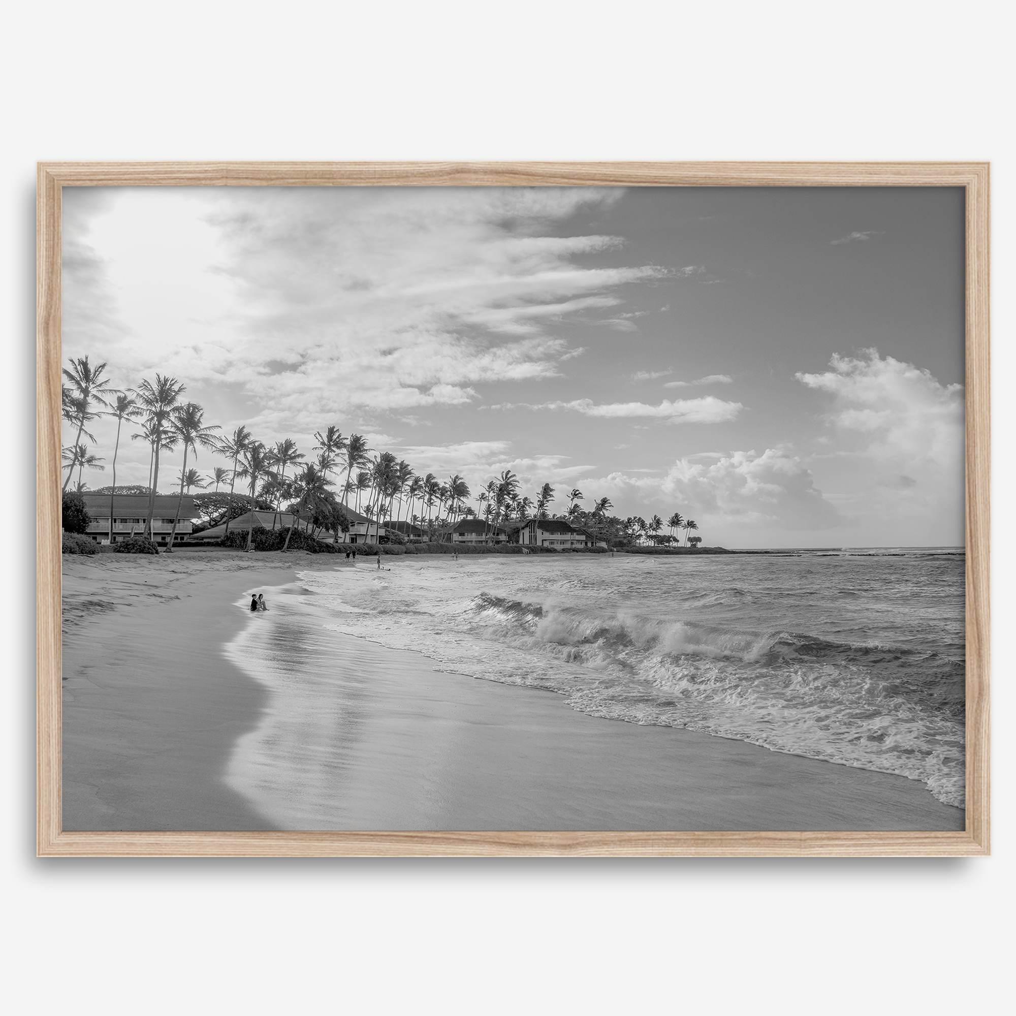 Black and white tropical wall art featuring a serene sunrise on a beach in Kauai, Hawaii with palm trees