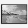 Black and white tropical wall art featuring a serene sunrise on a beach in Kauai, Hawaii with palm trees