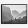 A black and white photography wall art of Yosemite Valley at sunset, featuring the iconic Half Dome and El Capitan bathed in dramatic light and shadow. Perfect for nature lovers and art enthusiasts.