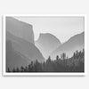A black and white photography wall art of Yosemite Valley at sunset, featuring the iconic Half Dome and El Capitan bathed in dramatic light and shadow. Perfect for nature lovers and art enthusiasts.