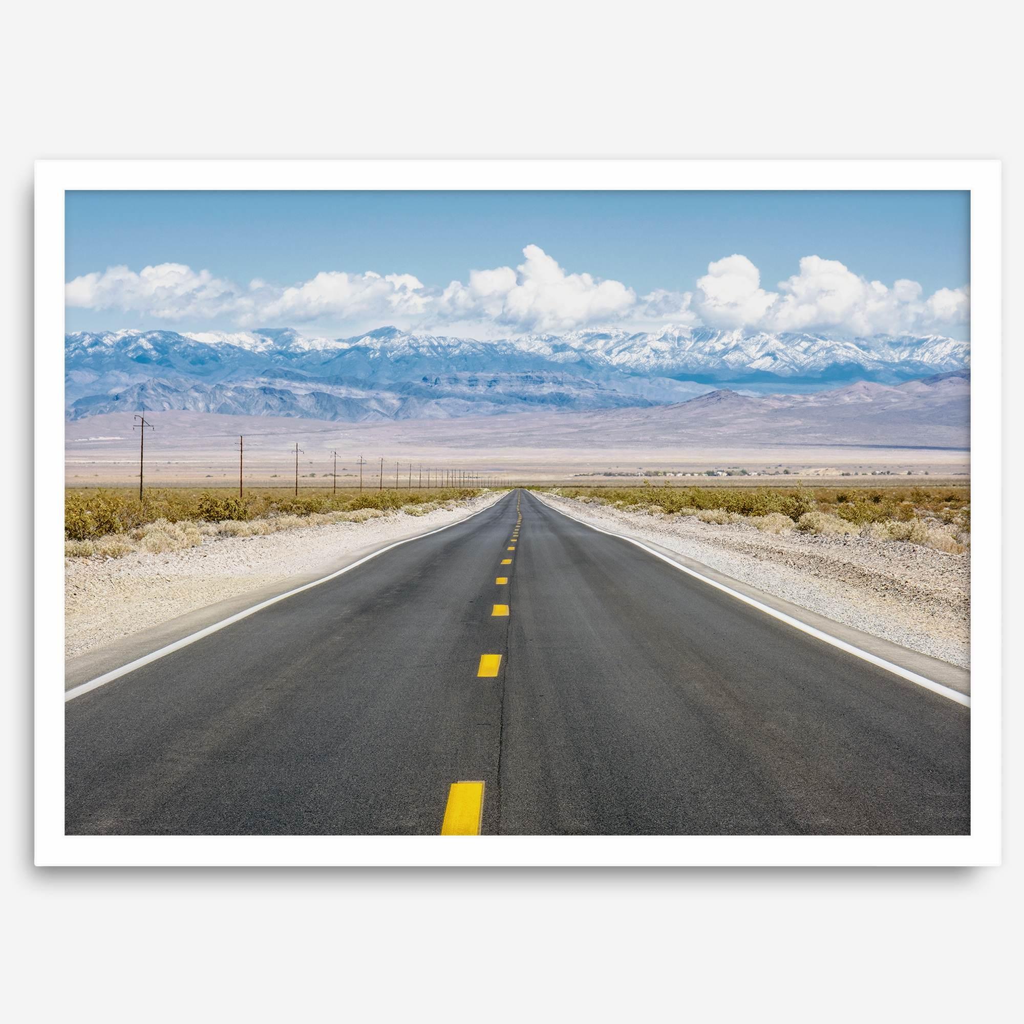 This stunning piece of desert wall art will take your breath away. This beautifully framed picture of a Death Valley National Park road leading towards the snow-covered mountains at the end of the desert will impress when hung on your walls.