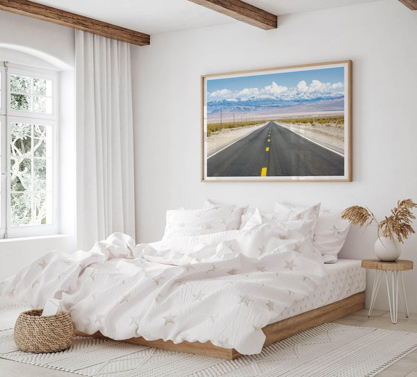 This stunning piece of desert wall art will take your breath away. This beautifully framed picture of a Death Valley National Park road leading towards the snow-covered mountains at the end of the desert will impress when hung on your walls.