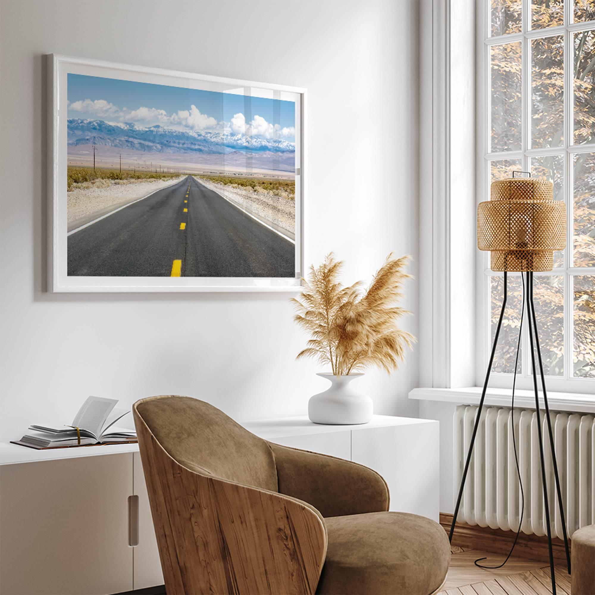 This stunning piece of desert wall art will take your breath away. This beautifully framed picture of a Death Valley National Park road leading towards the snow-covered mountains at the end of the desert will impress when hung on your walls.