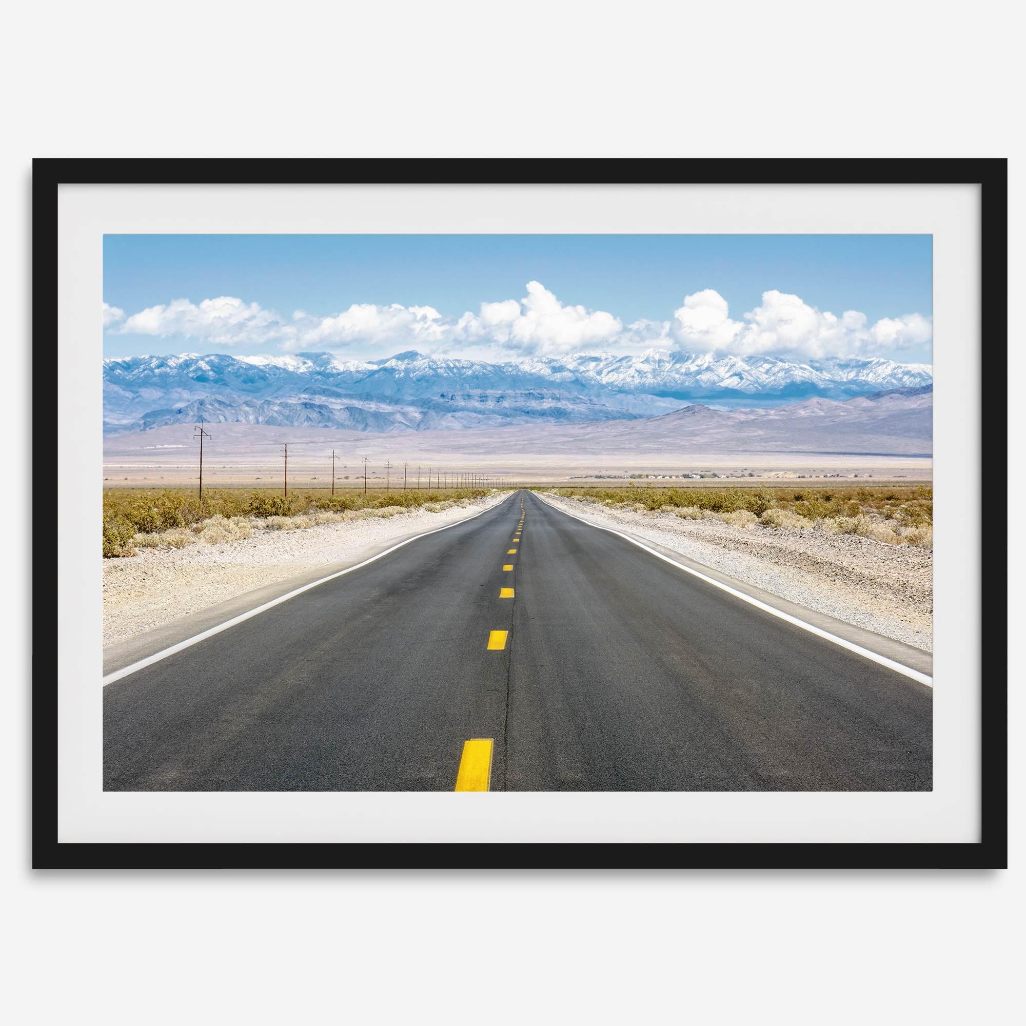 This stunning piece of desert wall art will take your breath away. This beautifully framed picture of a Death Valley National Park road leading towards the snow-covered mountains at the end of the desert will impress when hung on your walls.