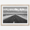 This stunning piece of black and white desert wall art will take your breath away. A beautifully framed picture of a Death Valley National Park road leading towards the snow-covered mountains at the end of the desert.