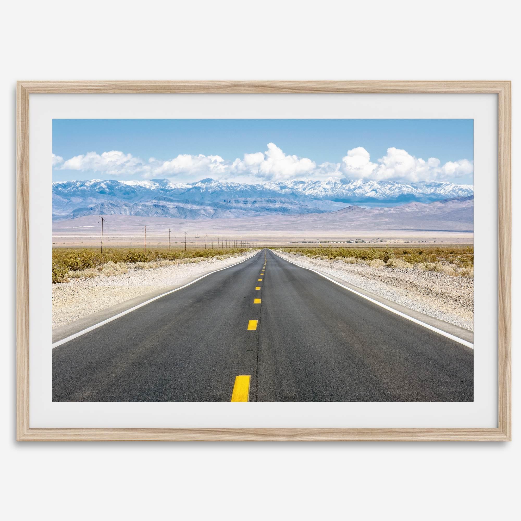 This stunning piece of desert wall art will take your breath away. This beautifully framed picture of a Death Valley National Park road leading towards the snow-covered mountains at the end of the desert will impress when hung on your walls.