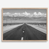 This stunning piece of black and white desert wall art will take your breath away. A beautifully framed picture of a Death Valley National Park road leading towards the snow-covered mountains at the end of the desert.