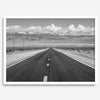 This stunning piece of black and white desert wall art will take your breath away. A beautifully framed picture of a Death Valley National Park road leading towards the snow-covered mountains at the end of the desert.
