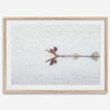 A fine art minimalist wildlife photography print showcasing a bird flying over a lake in Arizona.