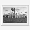 Black and white photo of the Pismo Beach street sign with palm trees and boardwalk – fine art coastal print