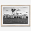 Black and white photo of the Pismo Beach street sign with palm trees and boardwalk – fine art coastal print