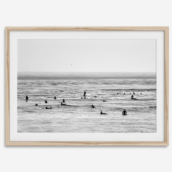 Black and white surf prints showing surfers in calm ocean waters, perfect for beach house wall art or minimalist coastal decor.
