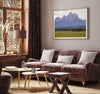 A stunning snow-covered mountain framed or unframed print from Grand Teton National Park with a beautiful horse grazing the grass in the forefront.