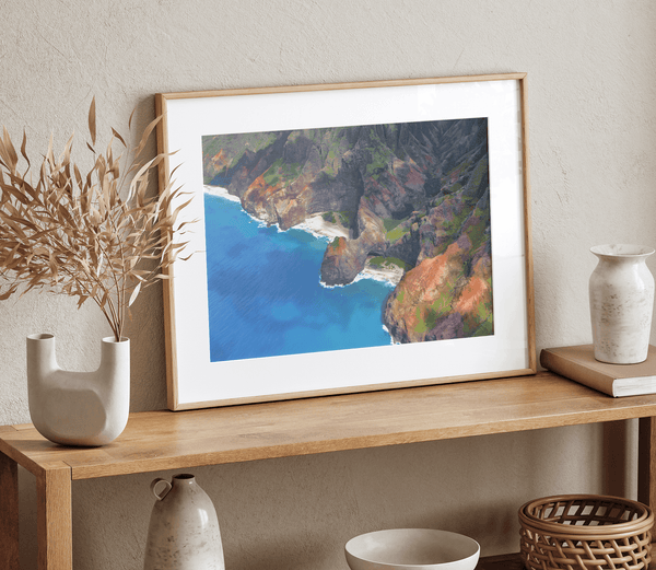 Fine art aerial photograph of the Na Pali Coast, Kauai, Hawaii. Colorful cliffs and a blue ocean create a mesmerizing beach scene.