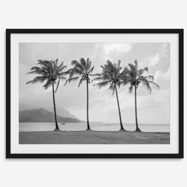Black and white Hanalei Beach wall art featuring four palm trees with a coastal Kauai backdrop.
