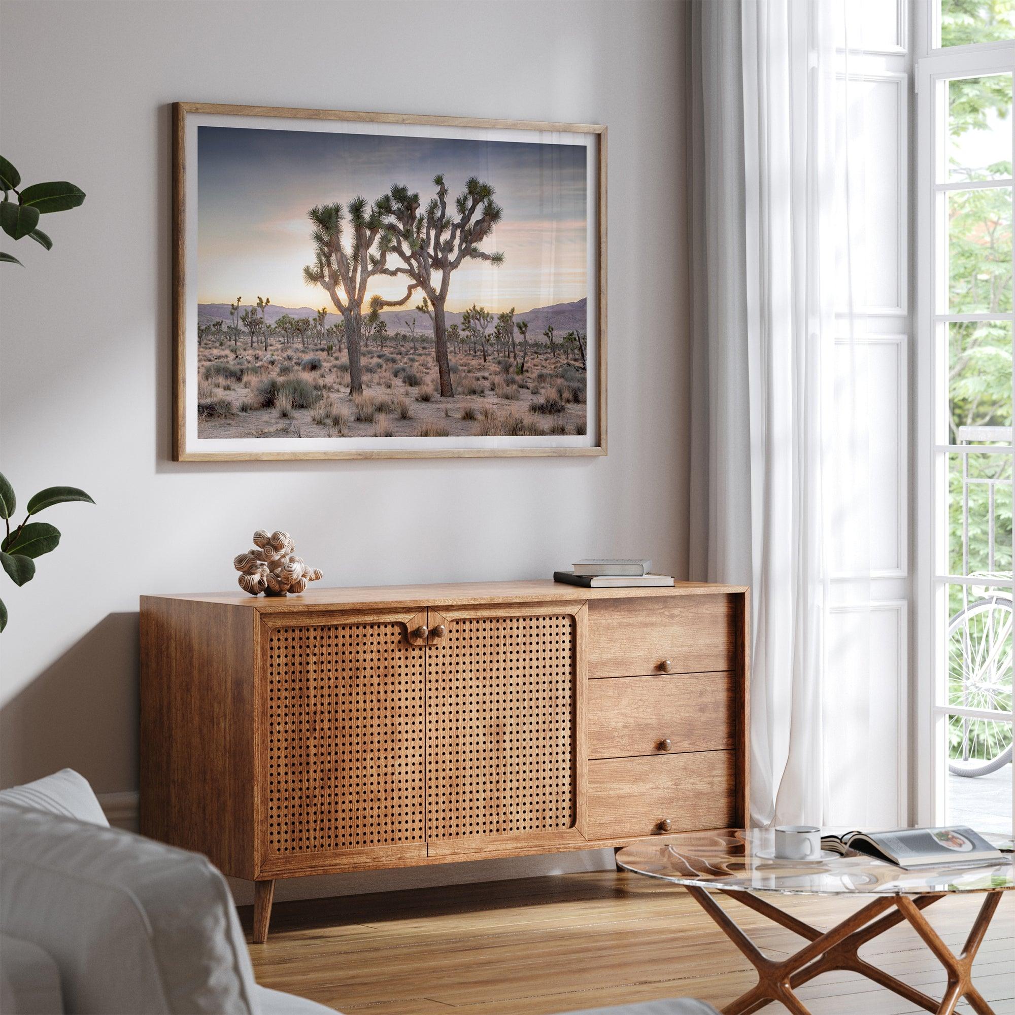 A framed fine art photography print from Joshua Tree National Park of two Joshua Trees in the Sunset. The trees appear to be holding hands. This California desert landscape wall art shows the famous Joshua Trees and desert plants in the Sunset.