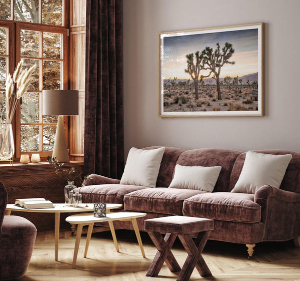 A framed fine art photography print from Joshua Tree National Park of two Joshua Trees in the Sunset. The trees appear to be holding hands. This California desert landscape wall art shows the famous Joshua Trees and desert plants in the Sunset.