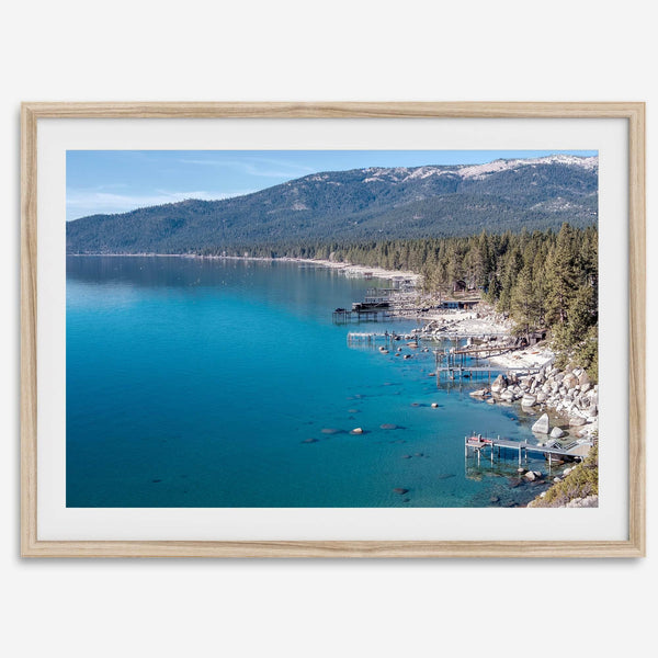 Captivating fine art print of Lake Tahoe showcasing docks, boats, beachfront, lush forest, majestic mountain, and serene waters, capturing the essence of lake life in Incline Village, Nevada.