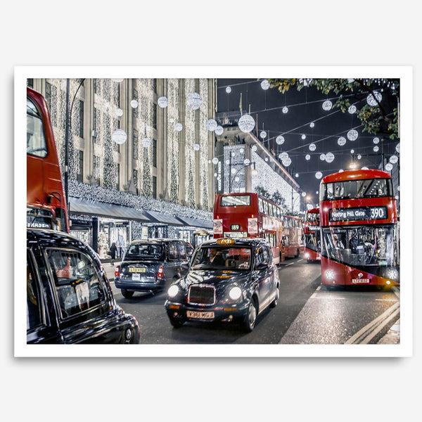 Fine art photography print of a bustling London street during Christmas, featuring double-decker buses, black taxis, and festive holiday lights.