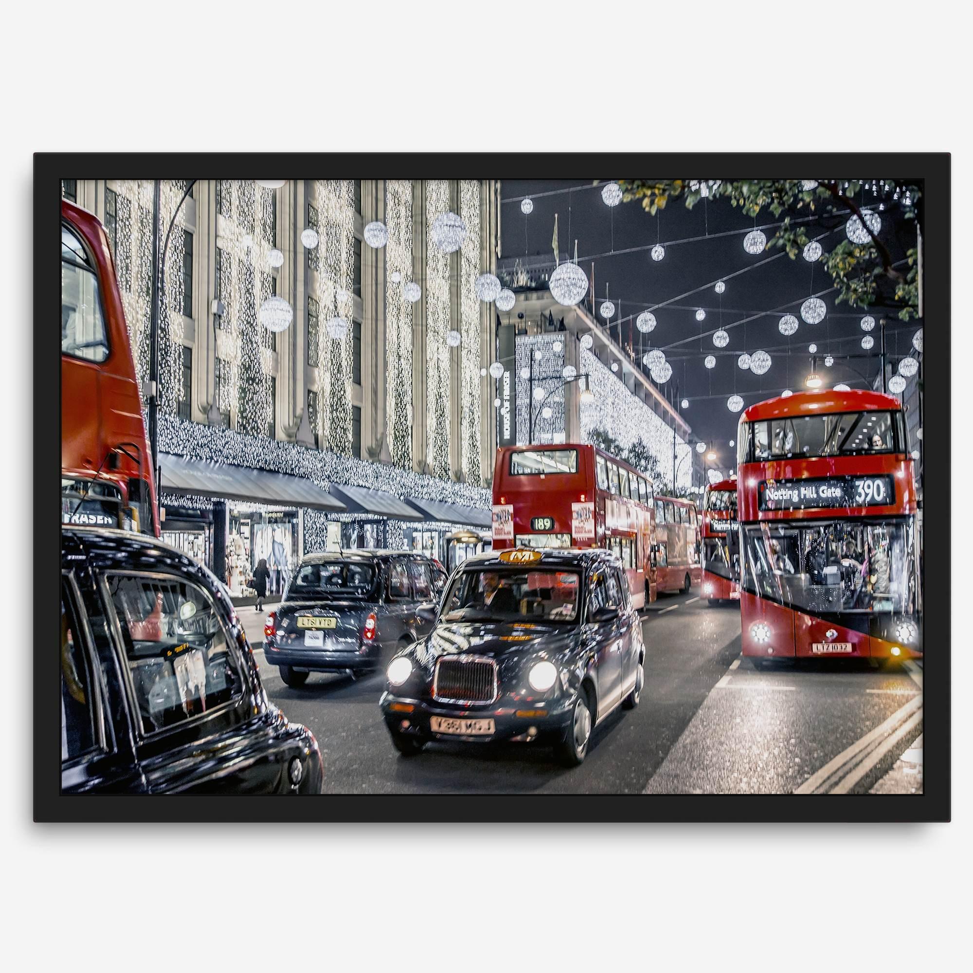 Fine art photography print of a bustling London street during Christmas, featuring double-decker buses, black taxis, and festive holiday lights.