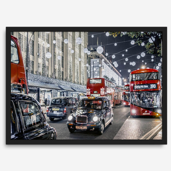 Fine art photography print of a bustling London street during Christmas, featuring double-decker buses, black taxis, and festive holiday lights.