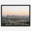 Los Angeles cityscape bathed in a vibrant sunset, showcasing the city's iconic buildings from above