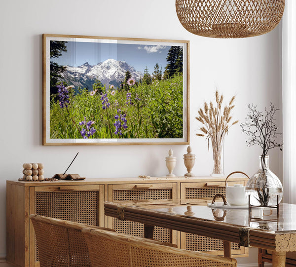 A framed or unframed fine art landscape photography print of Mount Rainier. This Washington wall art showcases a vast bed of flowers in the foreground with the backdrop of the snow-covered Mount Rainier. Perfect as a Mt Rainier National Park poster