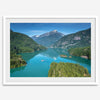 A fine art poster print of Diablo Lake in North Cascades National Park showcasing the deep blue water and the reflection of the surrounding mountains.