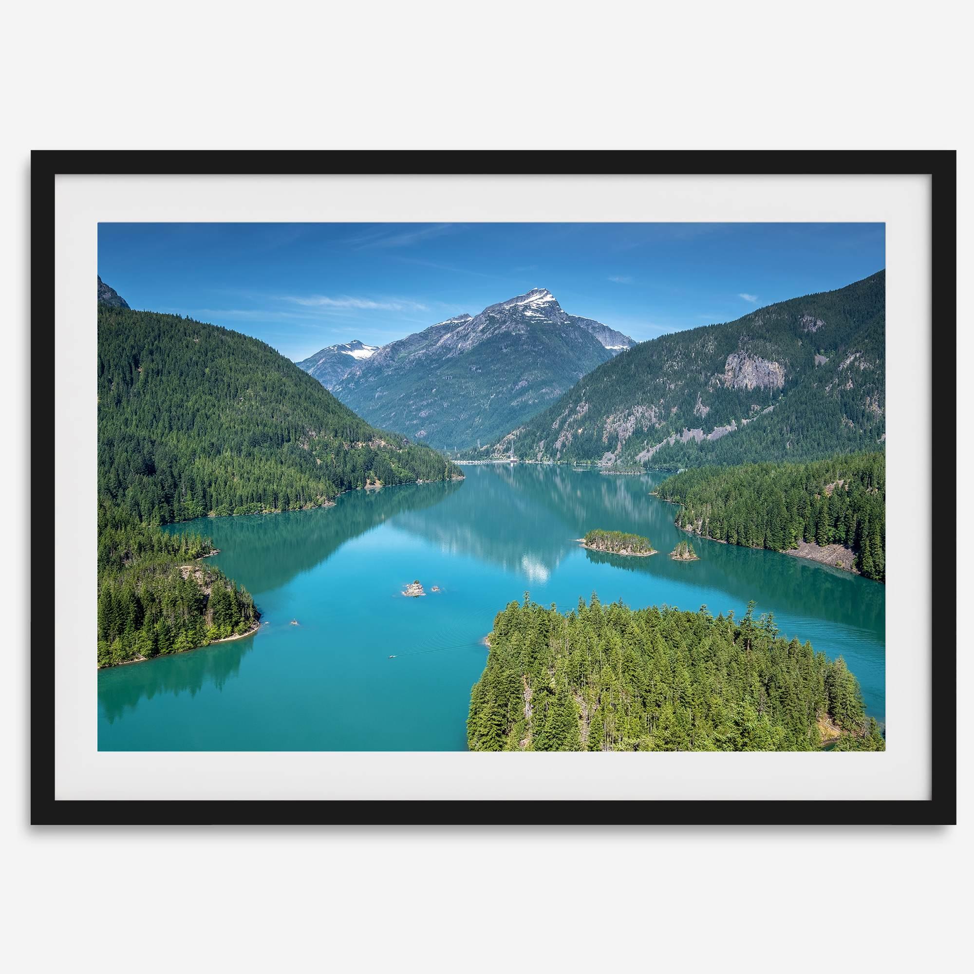 A fine art poster print of Diablo Lake in North Cascades National Park showcasing the deep blue water and the reflection of the surrounding mountains.