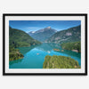 A fine art poster print of Diablo Lake in North Cascades National Park showcasing the deep blue water and the reflection of the surrounding mountains.