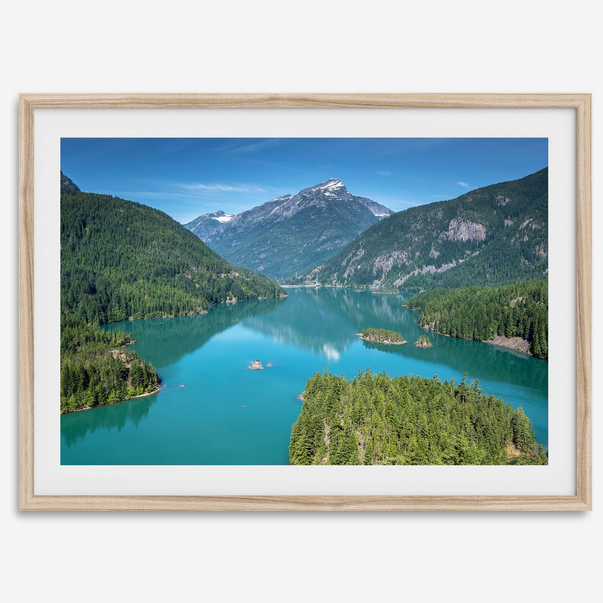 A fine art poster print of Diablo Lake in North Cascades National Park showcasing the deep blue water and the reflection of the surrounding mountains.