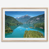 A fine art poster print of Diablo Lake in North Cascades National Park showcasing the deep blue water and the reflection of the surrounding mountains.