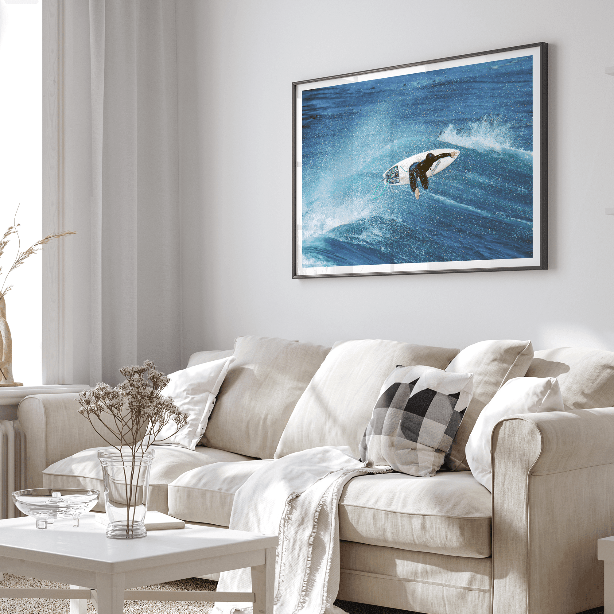 Surfer flying above a turquoise wave in Santa Cruz captured in vibrant ocean photography.