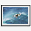 Surfer flying above a turquoise wave in Santa Cruz captured in vibrant ocean photography.