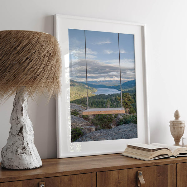 A fine art-inspiring photo print showcasing a swing on a tree with the backdrop of Donner Lake and the Pacific Northwest mountains.