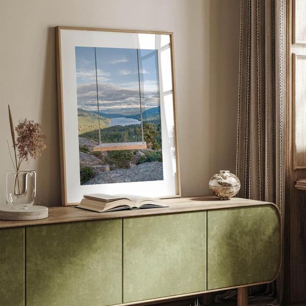 A fine art-inspiring photo print showcasing a swing on a tree with the backdrop of Donner Lake and the Pacific Northwest mountains.