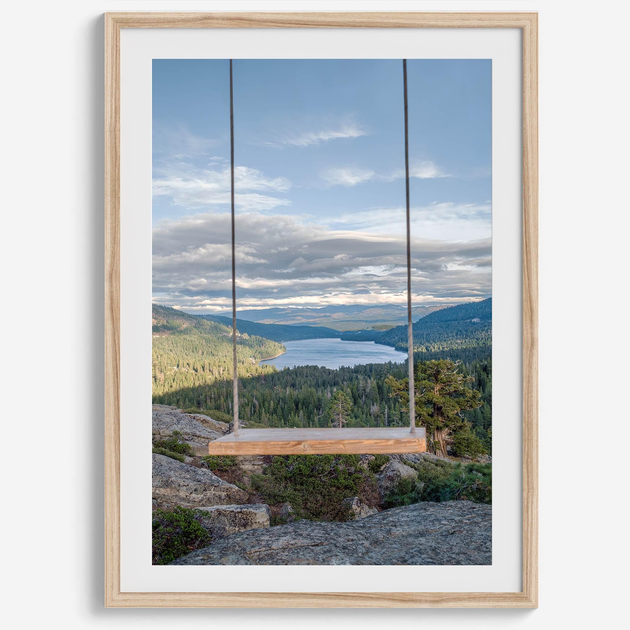 A fine art-inspiring photo print showcasing a swing on a tree with the backdrop of Donner Lake and the Pacific Northwest mountains.