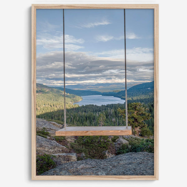A fine art-inspiring photo print showcasing a swing on a tree with the backdrop of Donner Lake and the Pacific Northwest mountains.